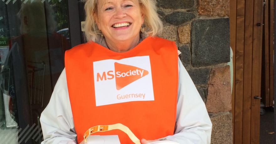 Holding a collection bucket outside Waitrose